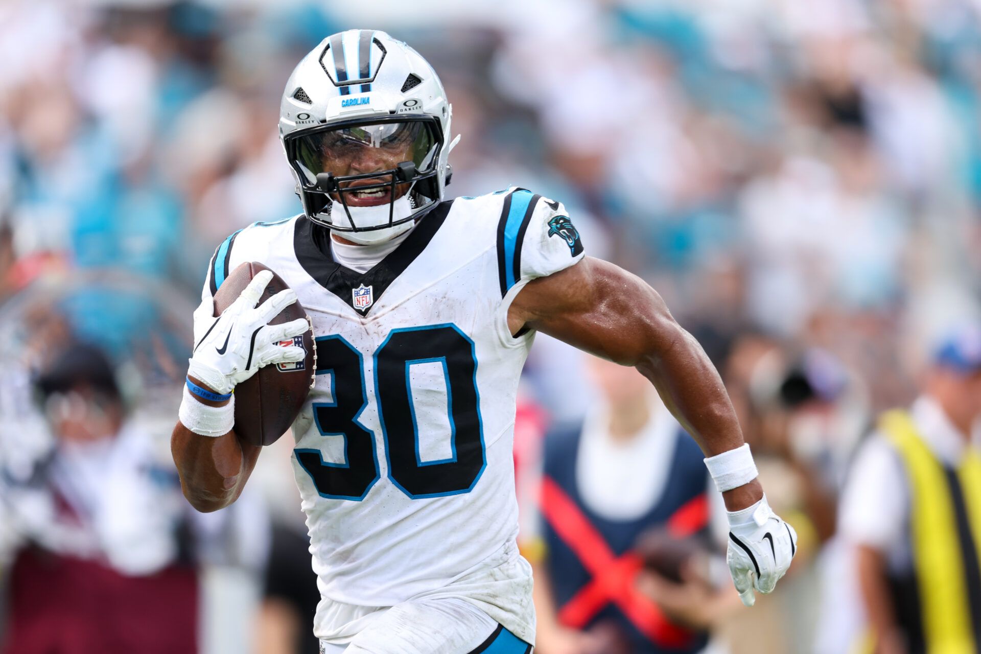 Carolina Panthers running back Chuba Hubbard (30) runs after the catch 27-yard touchdown reception during the second half against the Jacksonville Jaguars at EverBank Stadium.