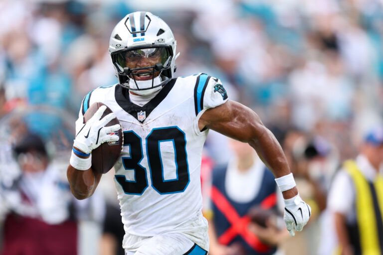 Carolina Panthers running back Chuba Hubbard (30) runs after the catch 27-yard touchdown reception during the second half against the Jacksonville Jaguars at EverBank Stadium.