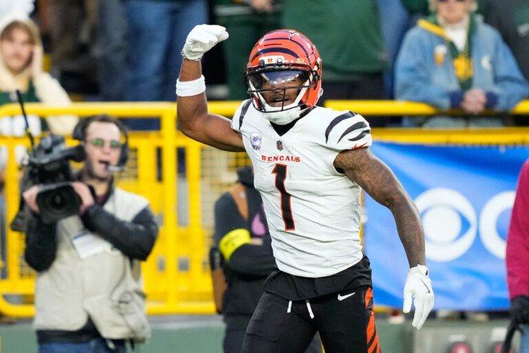 Cincinnati Bengals wide receiver Ja'Marr Chase (1) reacts after scoring a touchdown in the fourth quarter against the Green Bay Packers at Lambeau Field.