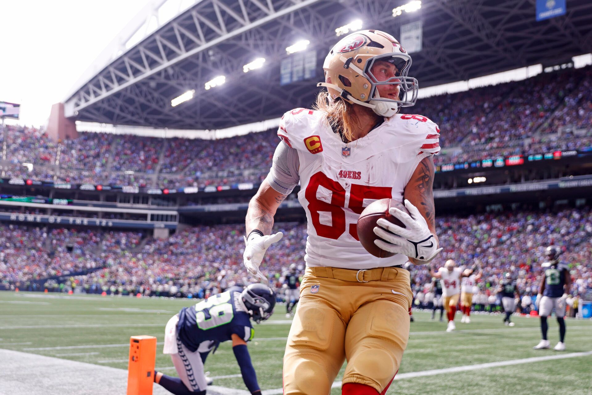 San Francisco 49ers tight end George Kittle (85) celebrates after scoring a touchdown during the first half against the Seattle Seahawks during the first quarter at Lumen Field.