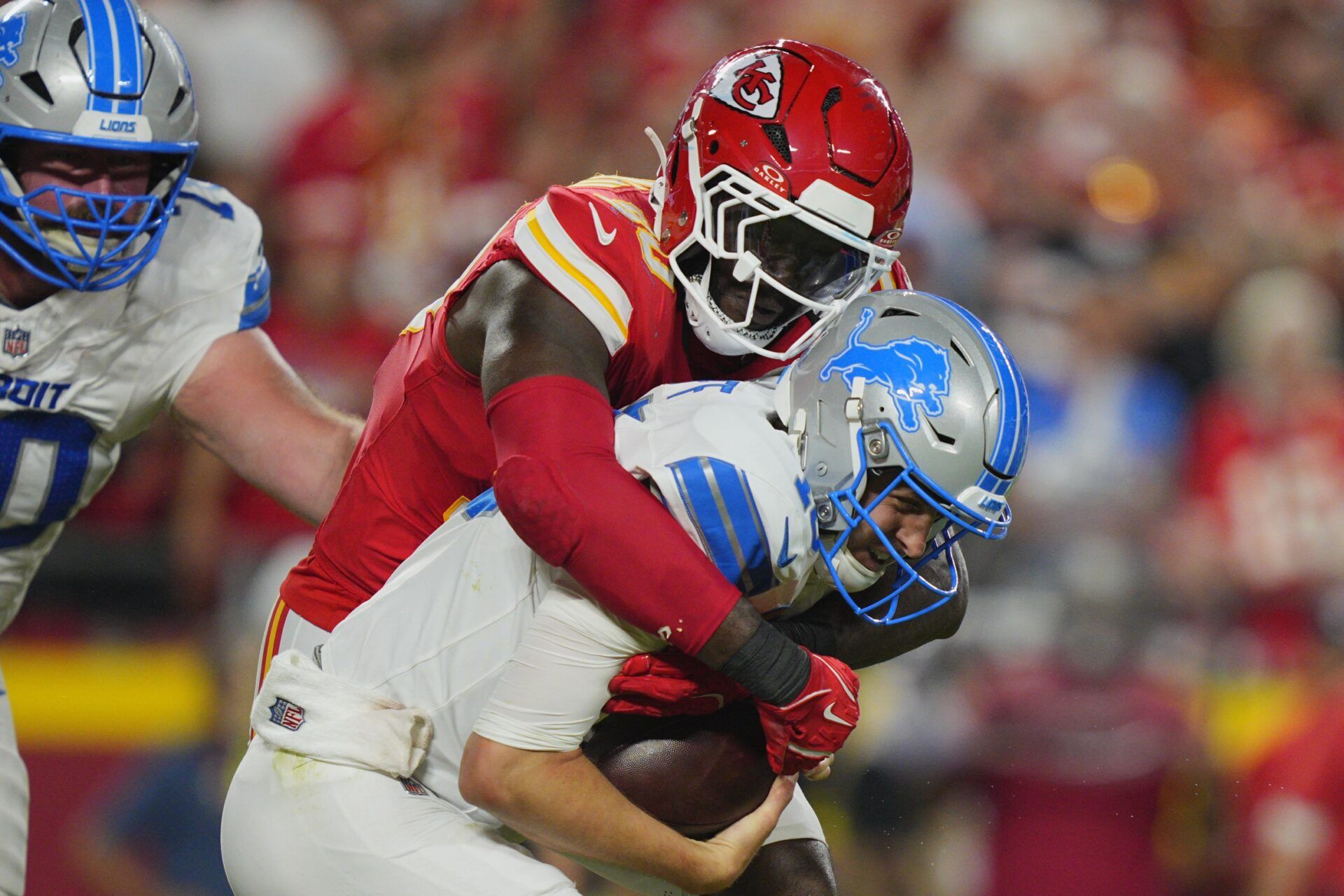 Kansas City Chiefs defensive end Charles Omenihu (90) sacks Detroit Lions quarterback Jared Goff (16) during the second half at GEHA Field at Arrowhead Stadium.