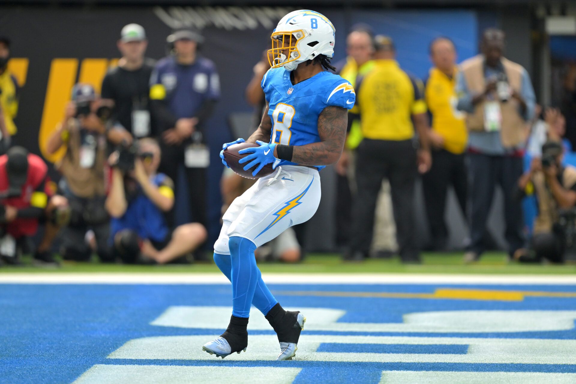 Los Angeles Chargers running back Omarion Hampton (8) runs for a touchdown in the first half against the Denver Broncos at SoFi Stadium.
