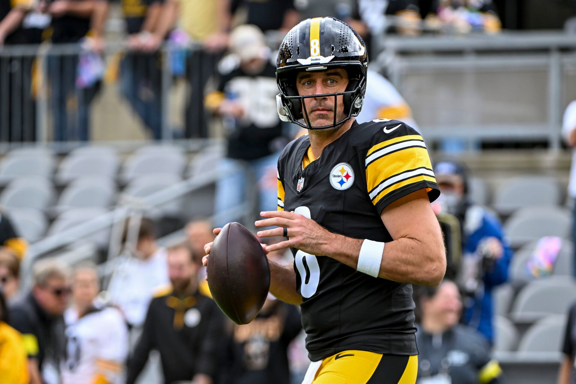 Pittsburgh Steelers quarterback Aaron Rodgers (8) warms up before the game at Acrisure Stadium.