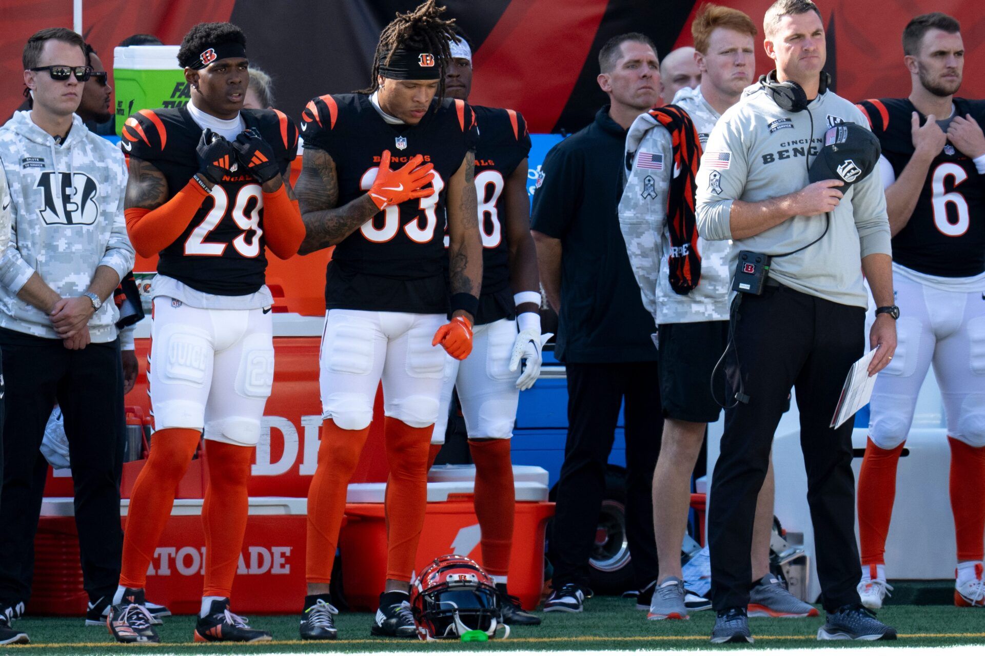 Cincinnati Bengals head coach Zac Taylor Cincinnati Bengals cornerback Cam Taylor-Britt (29) and Cincinnati Bengals safety Daijahn Anthony (33) look on during the National Anthem before the NFL game between the Cincinnati Bengals and the Las Vegas Raiders at Paycor Stadium in Cincinnati on Sunday, Nov. 3, 2024.