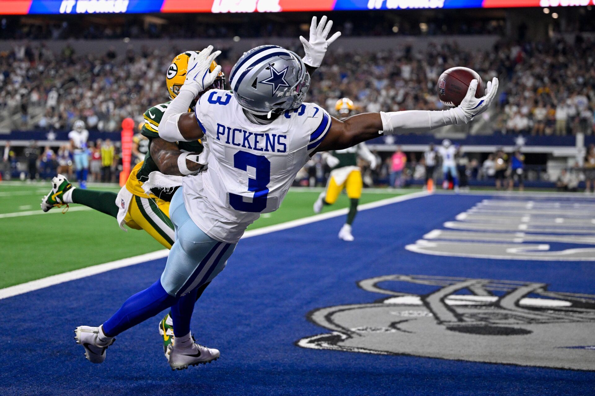 Green Bay Packers cornerback Keisean Nixon (25) breaks up a pass intended for Dallas Cowboys wide receiver George Pickens (3) during the game between the Dallas Cowboys and the Green Bay Packers at AT&T Stadium.