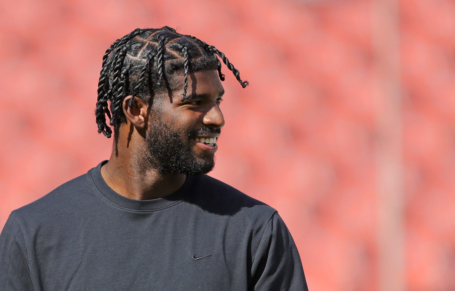 Cleveland Browns quarterback Shedeur Sanders is all smiles as he warms up before an NFL football game at Huntington Bank Field, Sept. 21, 2025, in Cleveland, Ohio.