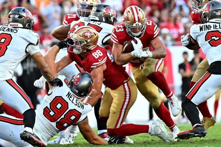 San Francisco 49ers running back Christian McCaffrey (23) runs for a gain during the third quarter against the Tampa Bay Buccaneers at Raymond James Stadium.