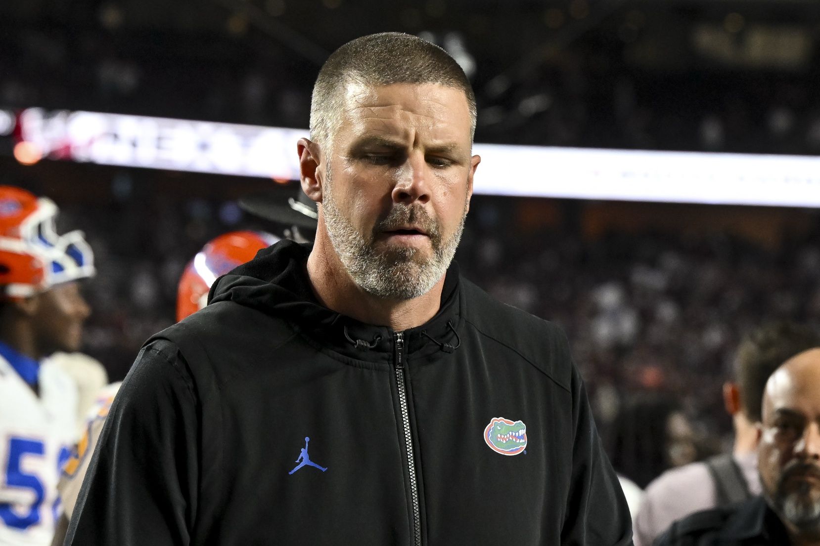 Florida Gators head coach Billy Napier walks off the field after the game against the Texas A&M Aggies at Kyle Field.