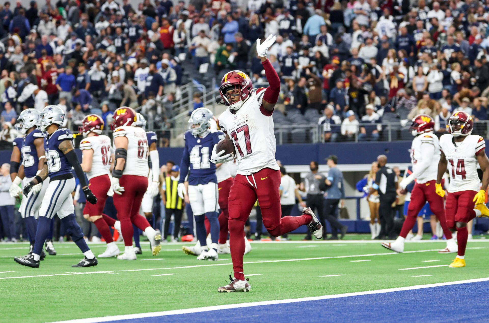 Washington Commanders wide receiver Terry McLaurin (17) celebrates after scoring the game-winning touchdown  during the fourth quarter against the Dallas Cowboys at AT&T Stadium.