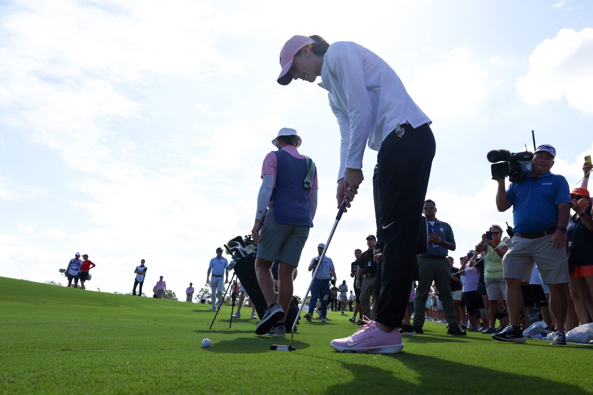 Indiana Fever guard Caitlin Clark (22) gets ready to putt during The Annika golf tournament Pro Am at Pelican Golf Club.