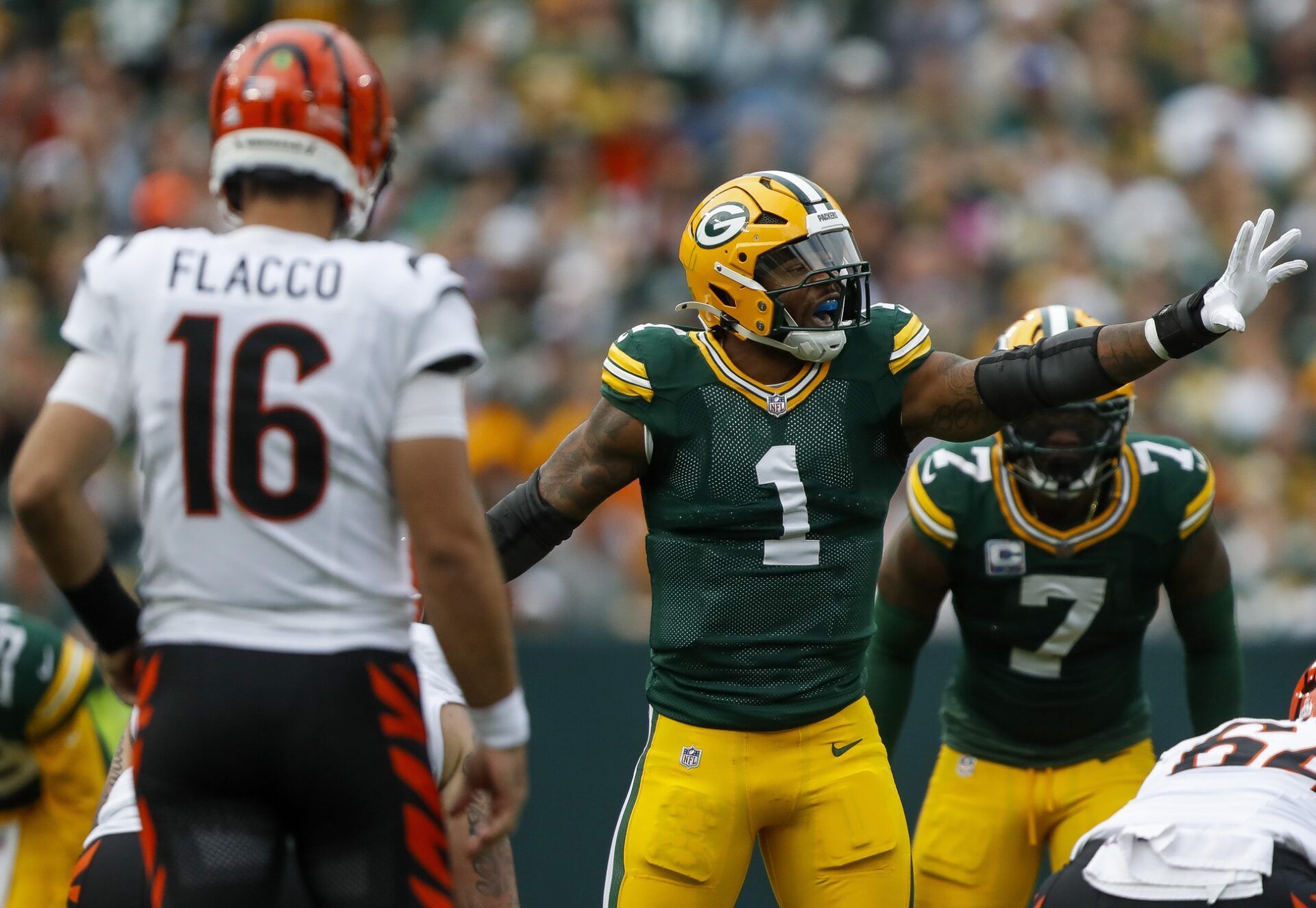 Green Bay Packers defensive end Micah Parsons (1) signals to teammates before the snap against the Cincinnati Bengals  during the game at Lambeau Field.