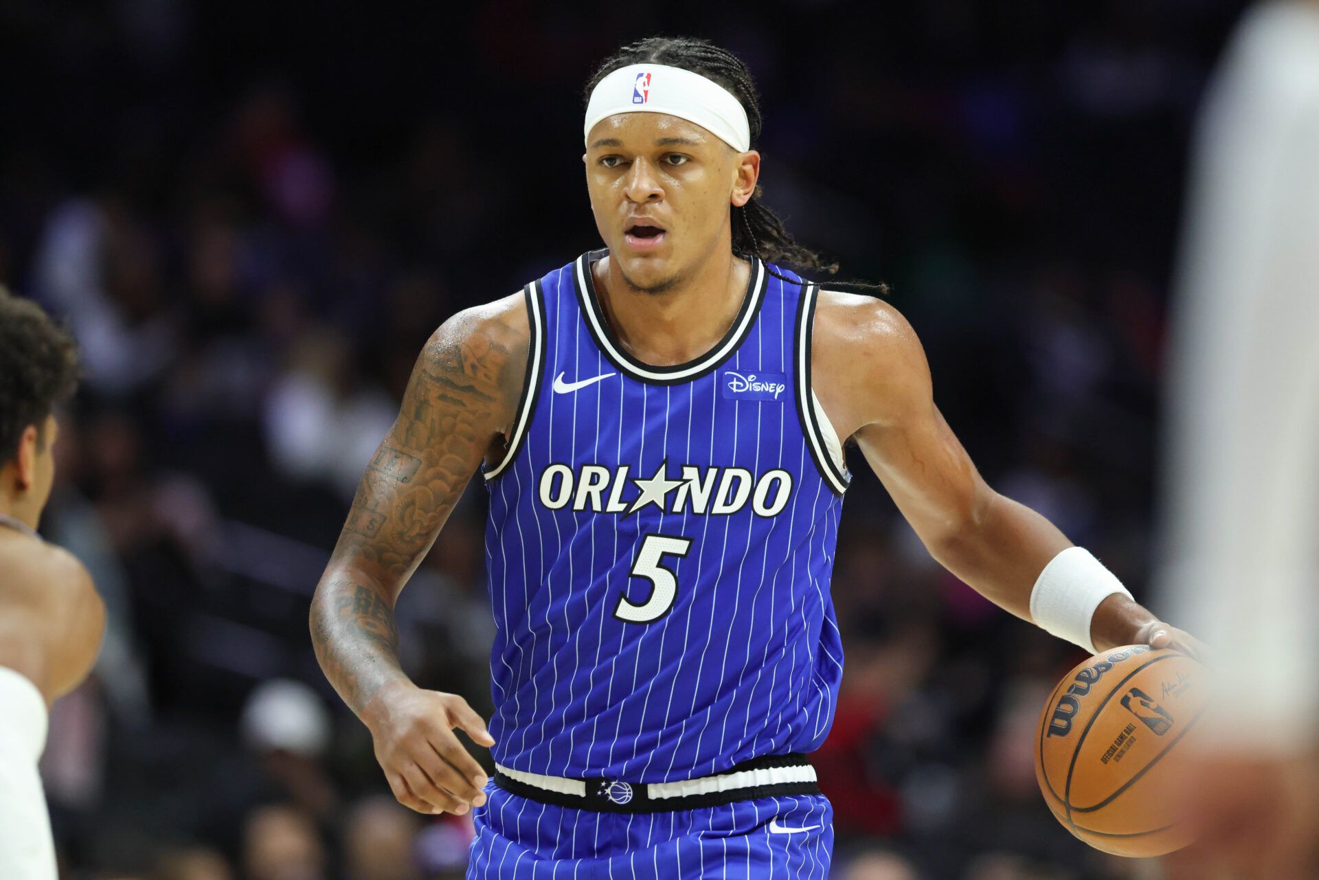 Orlando Magic forward Paolo Banchero (5) dribbles the ball against the Philadelphia 76ers during the third quarter at Xfinity Mobile Arena.