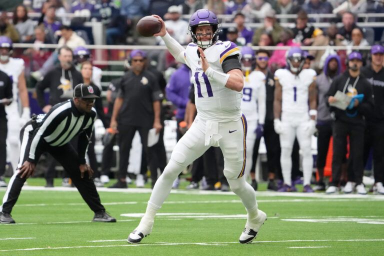 Minnesota Vikings quarterback Carson Wentz (11) passes the ball against the Cleveland Browns during the third quarter of an NFL International Series game at Tottenham Hotspur Stadium.