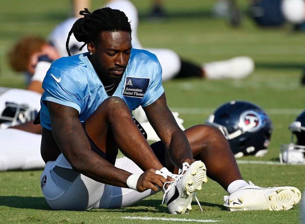 Tennessee Titans wide receiver Calvin Ridley (0) adjusted his cleats during an NFL football training camp practice at Ascension Saint Thomas Sports Park Saturday, Aug. 2, 2025, in Nashville, Tenn.
