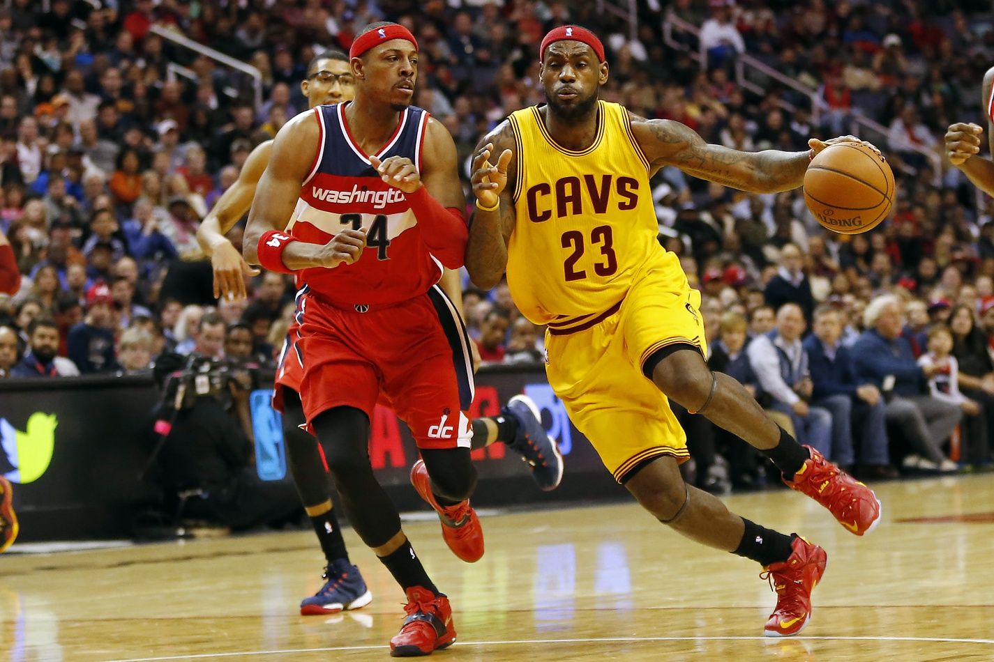 Cleveland Cavaliers forward LeBron James (23) dribbles the ball as Washington Wizards forward Paul Pierce (34) defends in the third quarter at Verizon Center. The Wizards won 91-78.