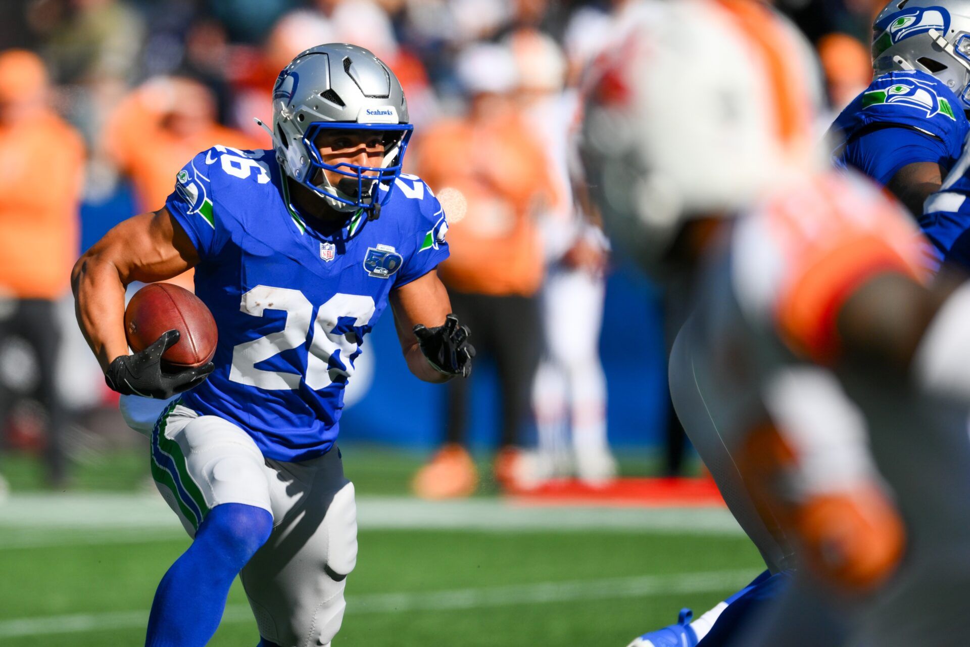 Seattle Seahawks running back Zach Charbonnet (26) carries the ball for a touchdown against the Tampa Bay Buccaneers during the second half at Lumen Field.