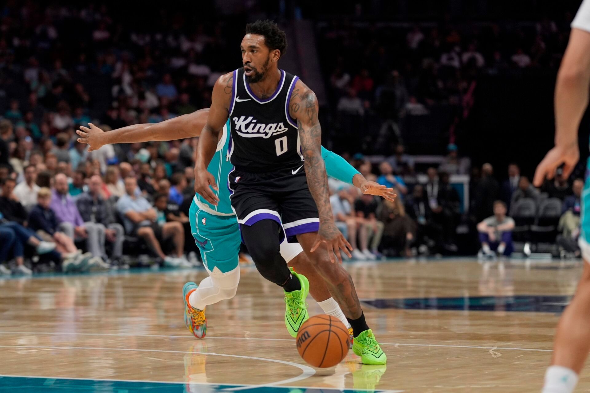 Sacramento Kings guard Malik Monk (0) drives to the basket against the Charlotte Hornets during the second quarter at Spectrum Center.