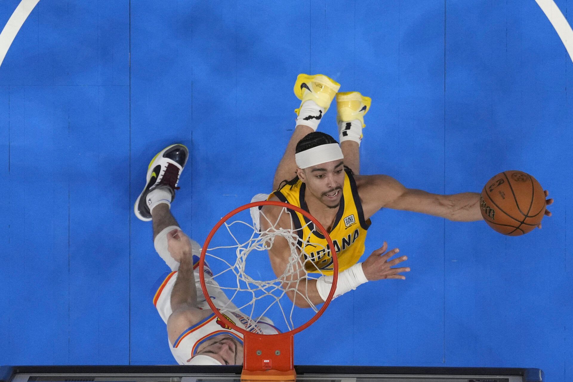 Indiana Pacers guard Andrew Nembhard (2) shoots against Oklahoma City Thunder guard Alex Caruso (9) during the fourth quarter of game five of the 2025 NBA Finals at Paycom Center.