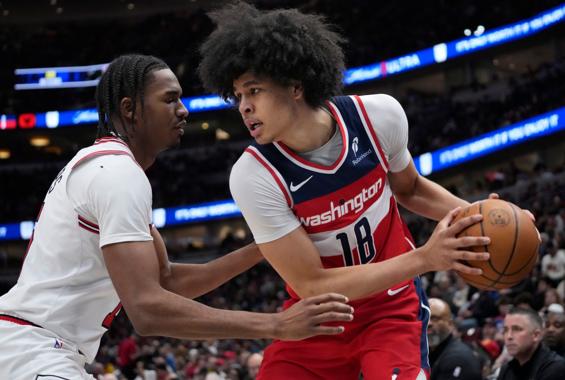 Chicago Bulls forward Julian Phillips (15) defends Washington Wizards forward Kyshawn George (18) during the second half at United Center.