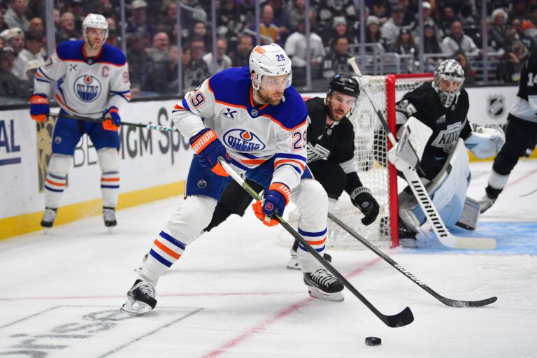 Edmonton Oilers center Leon Draisaitl (29) moves the puck against Los Angeles Kings right wing Adrian Kempe (9) during the first period in game five of the first round of the 2025 Stanley Cup Playoffs at Crypto.com Arena.