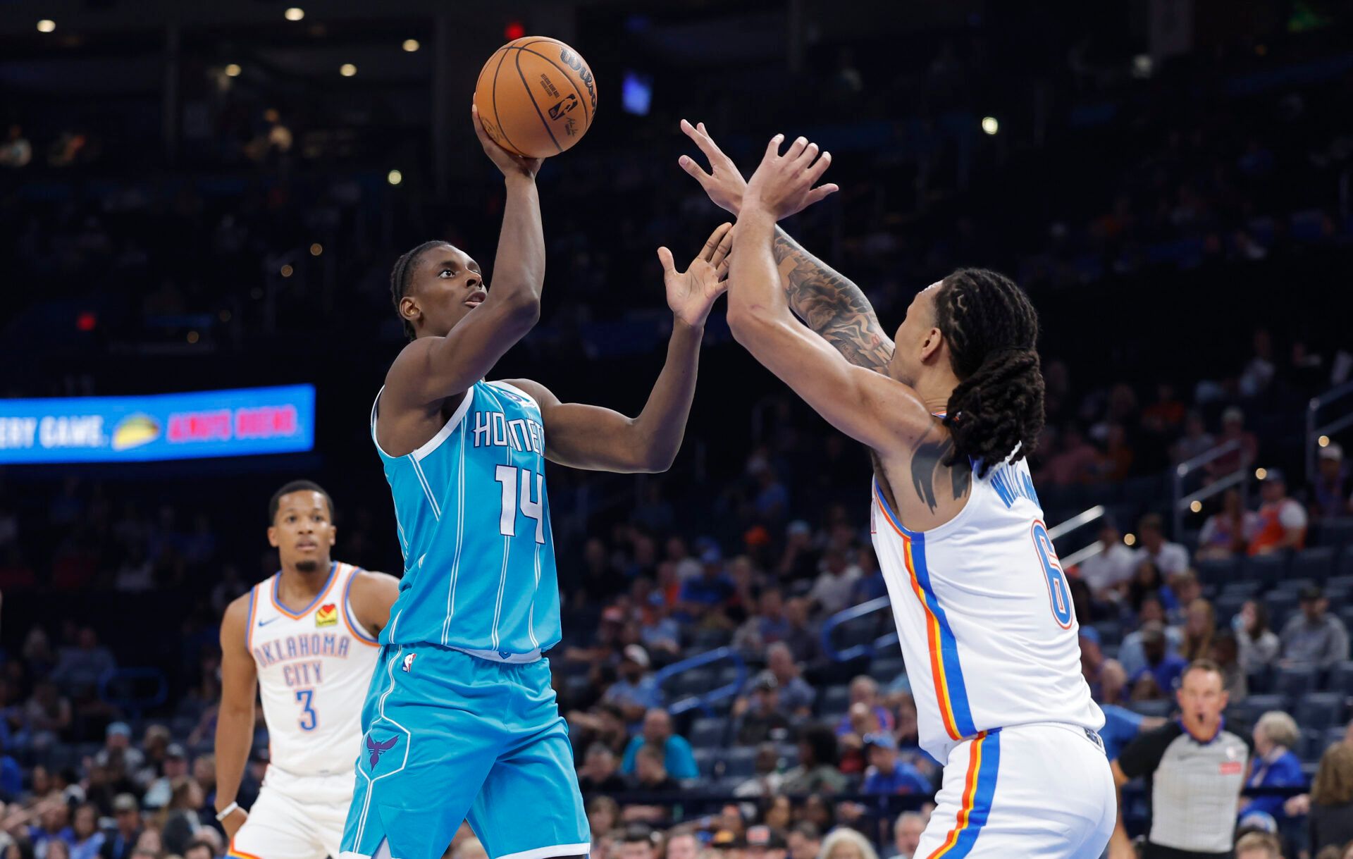 Charlotte Hornets forward Moussa Diabaté (14) shoots as Oklahoma City Thunder forward Jaylin Williams (6) defends during the second half of a game between the Charlotte Hornets and the Oklahoma City Thunder at Paycom Center.