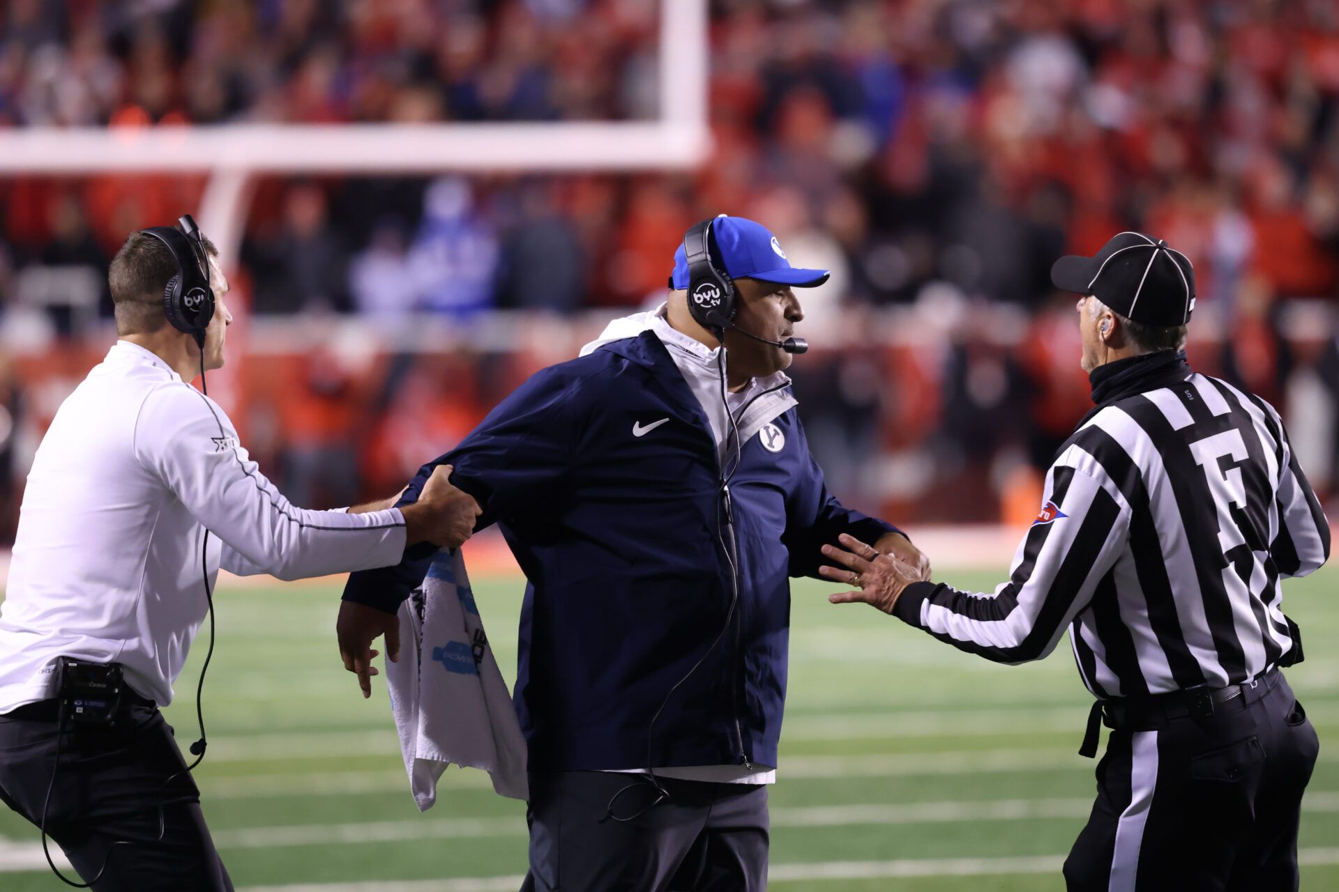 Brigham Young Cougars head coach Kalani Sitake reacts after a call for the Utah Utes during the fourth quarter at Rice-Eccles Stadium.