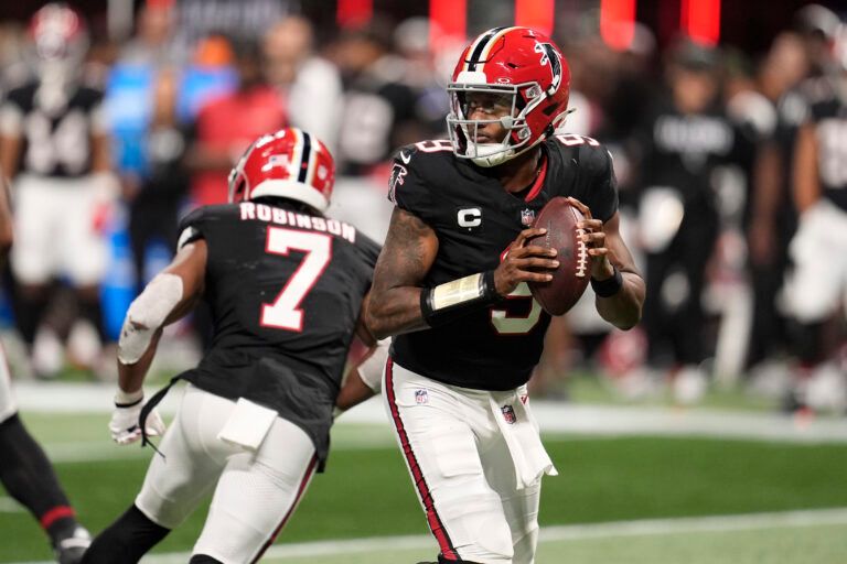 Atlanta Falcons quarterback Michael Penix Jr. (9) looks downfield against the Buffalo Bills during the second half of a game at Mercedes-Benz Stadium.