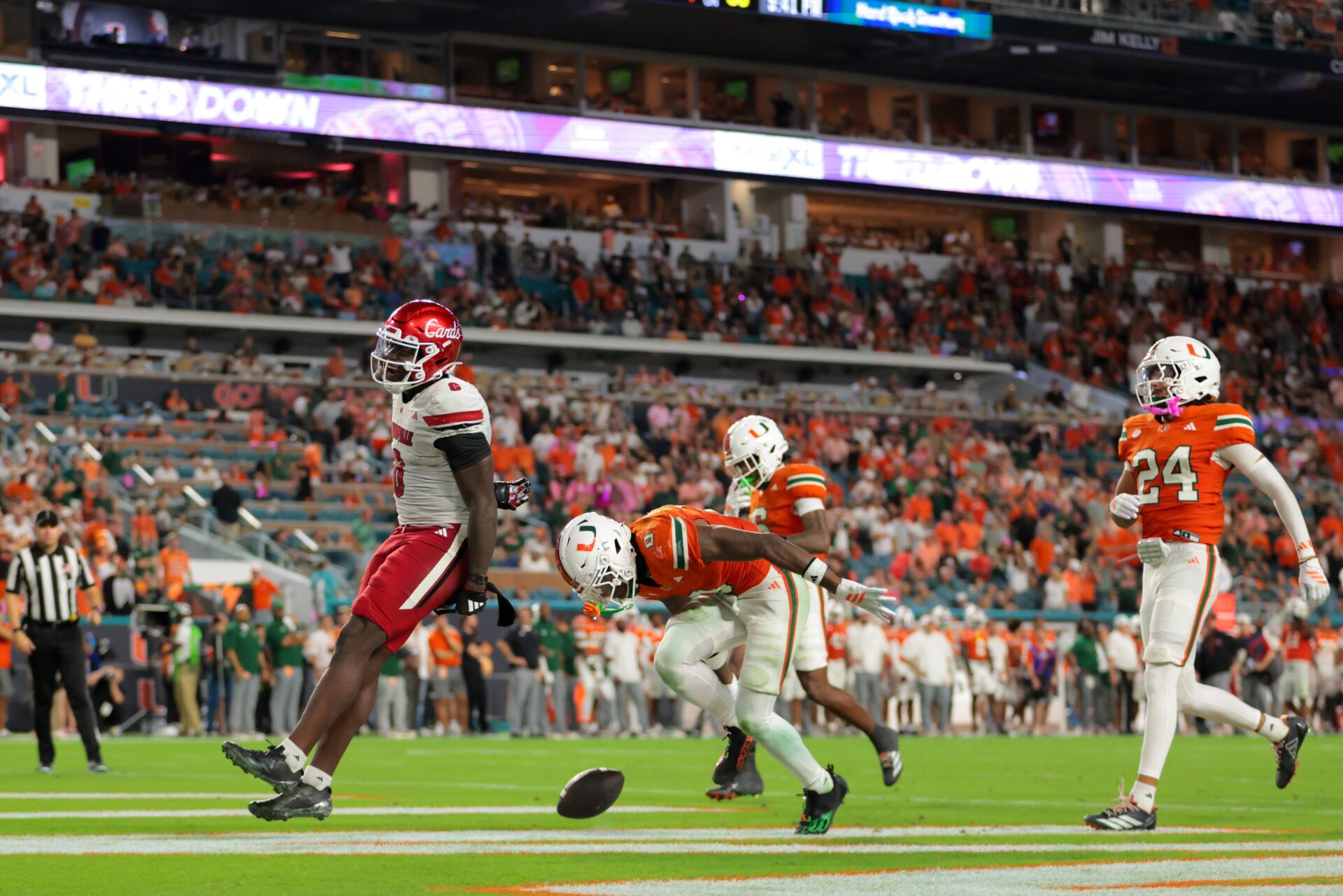 Louisville Cardinals wide receiver Chris Bell (0) scores a touchdown against the Miami Hurricanes during the fourth quarter at Hard Rock Stadium.