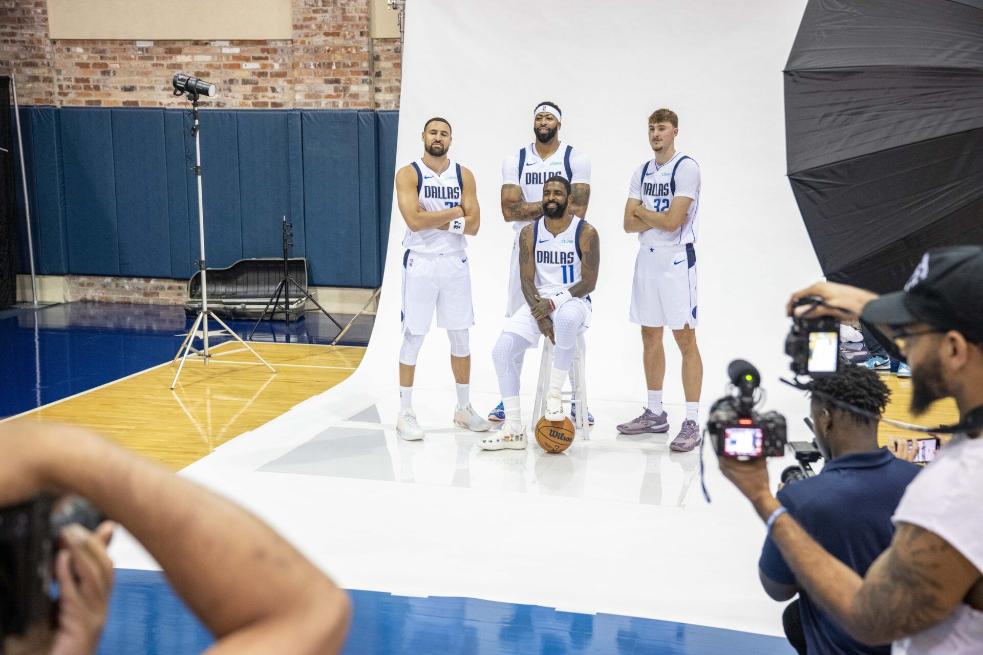 Dallas Mavericks forward Anthony Davis (3) and guard Kyrie Irving (11) and forward Cooper Flagg (32) and guard Klay Thompson (31) pose for a photo during the Mavericks 2025 media day at the American Airlines Center.