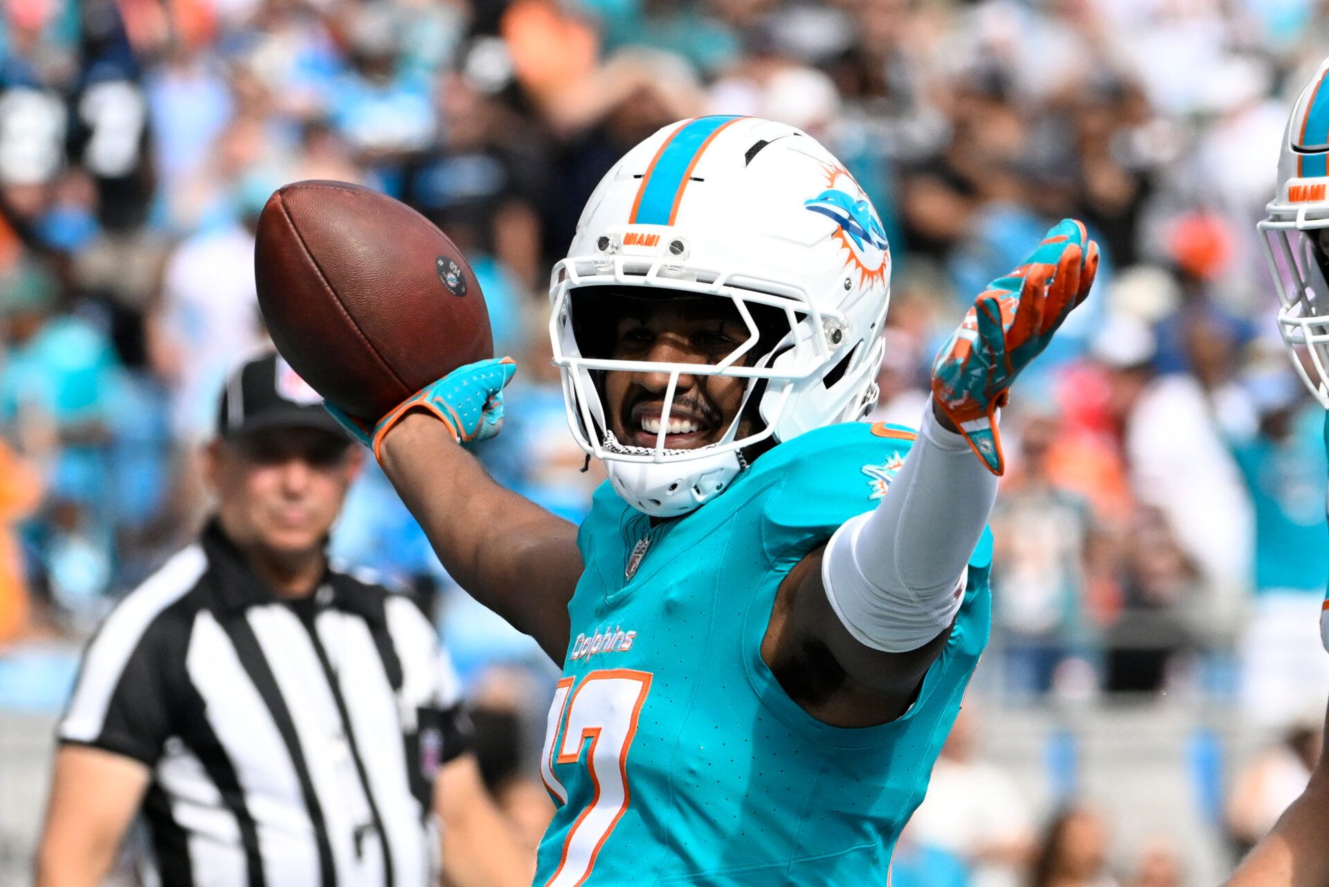 Miami Dolphins wide receiver Jaylen Waddle (17) celebrates after scoring a touchdown in the fourth quarter at Bank of America Stadium.