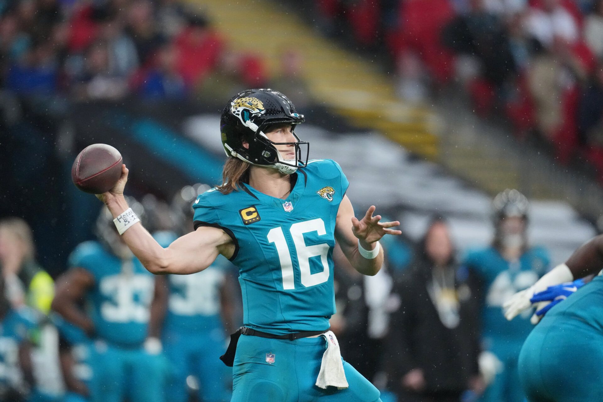Jacksonville Jaguars quarterback Trevor Lawrence (16) passes the ball against the Los Angeles Rams during the first half of an NFL International Series game at Wembley Stadium.