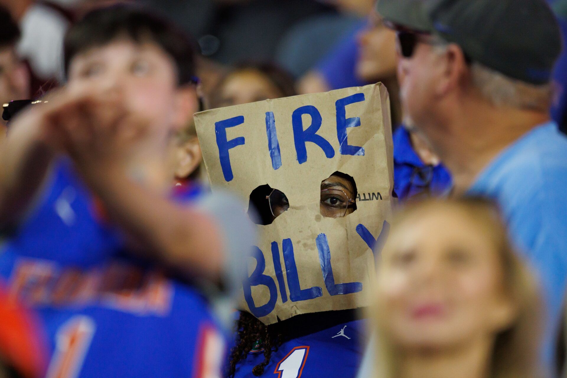 A fan wears a Fire Billy Napier bag over their head between the Florida Gators and Mississippi State Bulldogs during the second half at Ben Hill Griffin Stadium.