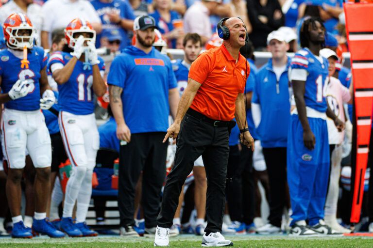 Florida Gators assistant coach for wide receivers Billy Gonzales calls a play against the Texas Longhorns during the second half at Ben Hill Griffin Stadium.