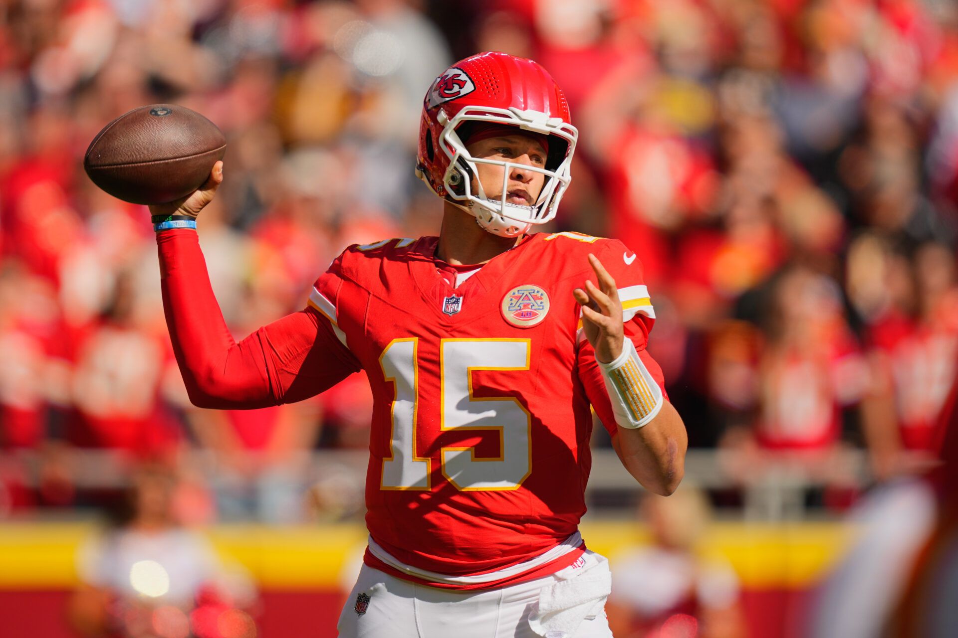 Kansas City Chiefs quarterback Patrick Mahomes (15) passes the ball against the Las Vegas Raiders during the first quarter of the game at GEHA Field at Arrowhead Stadium.