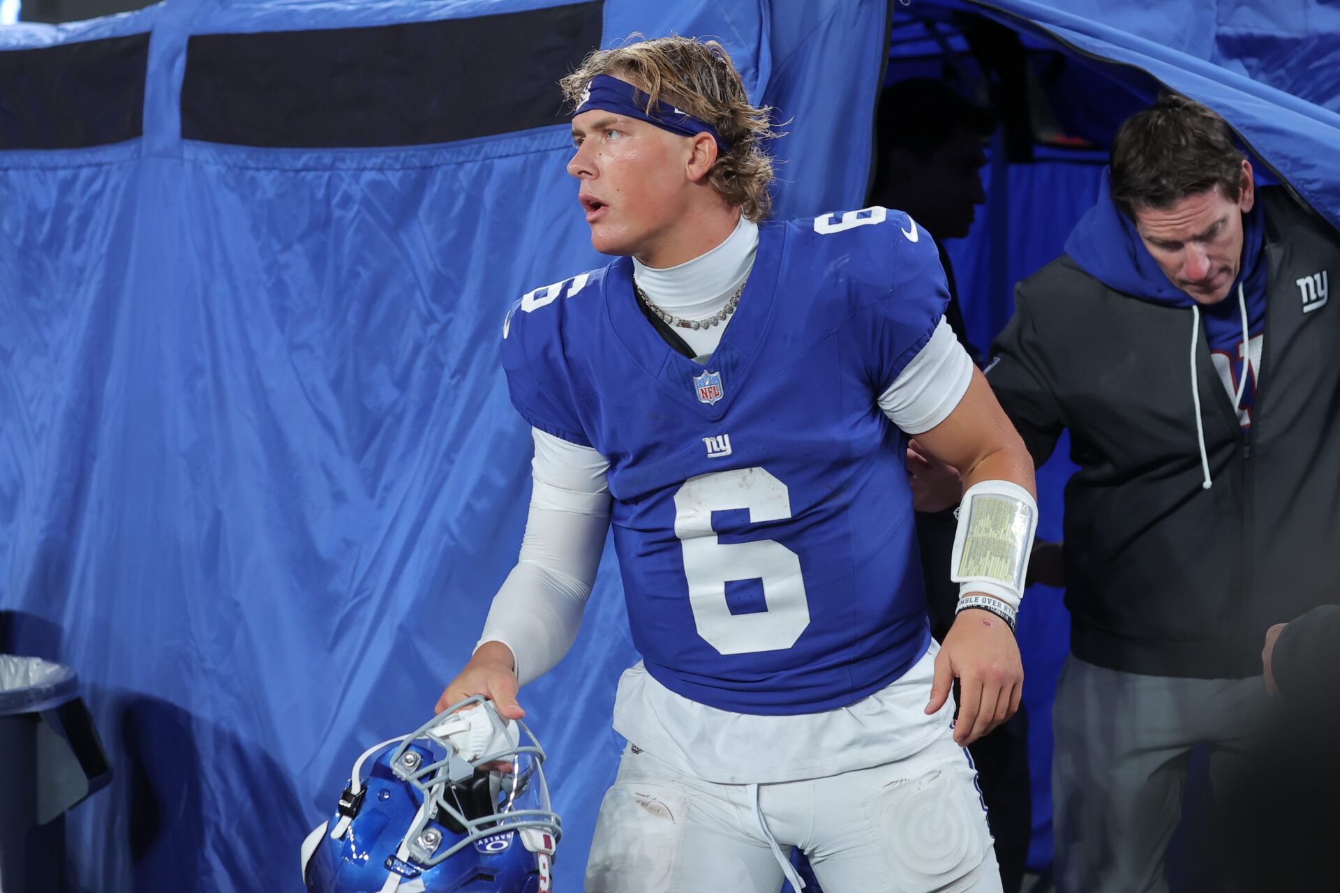 New York Giants quarterback Jaxson Dart (6) leaves the injury tent during the third quarter of the game against the Philadelphia Eagles at MetLife Stadium.