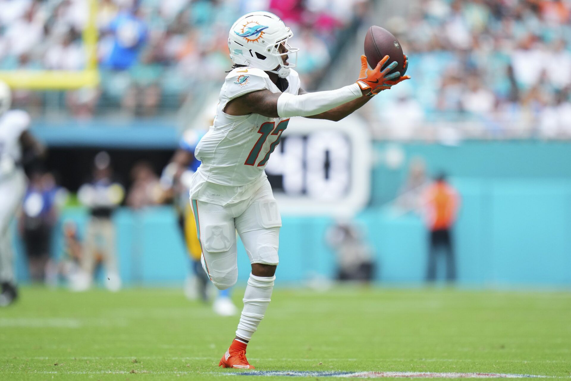 Miami Dolphins wide receiver Jaylen Waddle (17) catches a pass against the Los Angeles Chargers during the second quarter at Hard Rock Stadium.