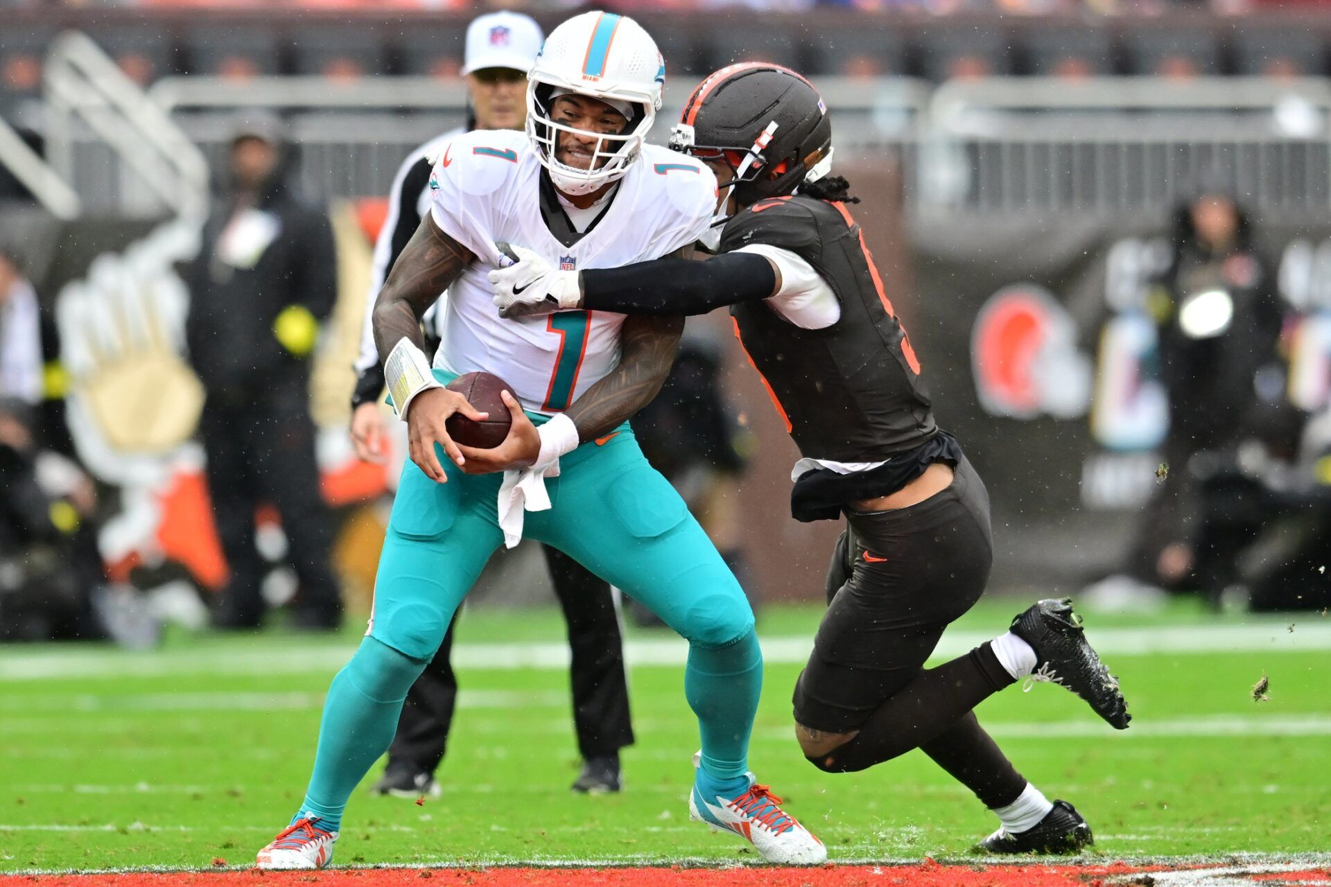 Cleveland Browns safety Grant Delpit (9) sacks Miami Dolphins quarterback Tua Tagovailoa (1) during the first half at Huntington Bank Field.