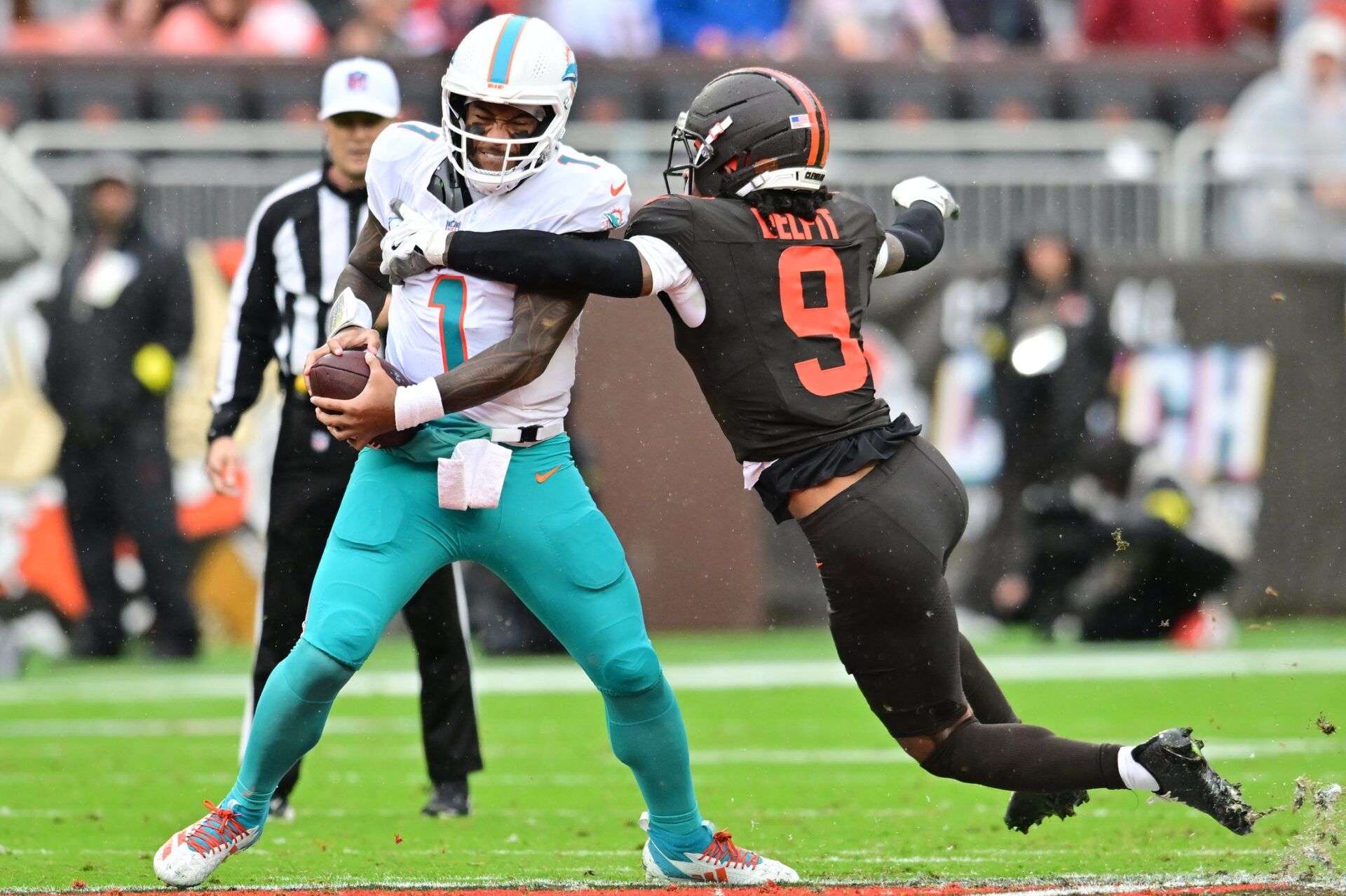 Cleveland Browns safety Grant Delpit (9) sacks Miami Dolphins quarterback Tua Tagovailoa (1) during the first half at Huntington Bank Field.