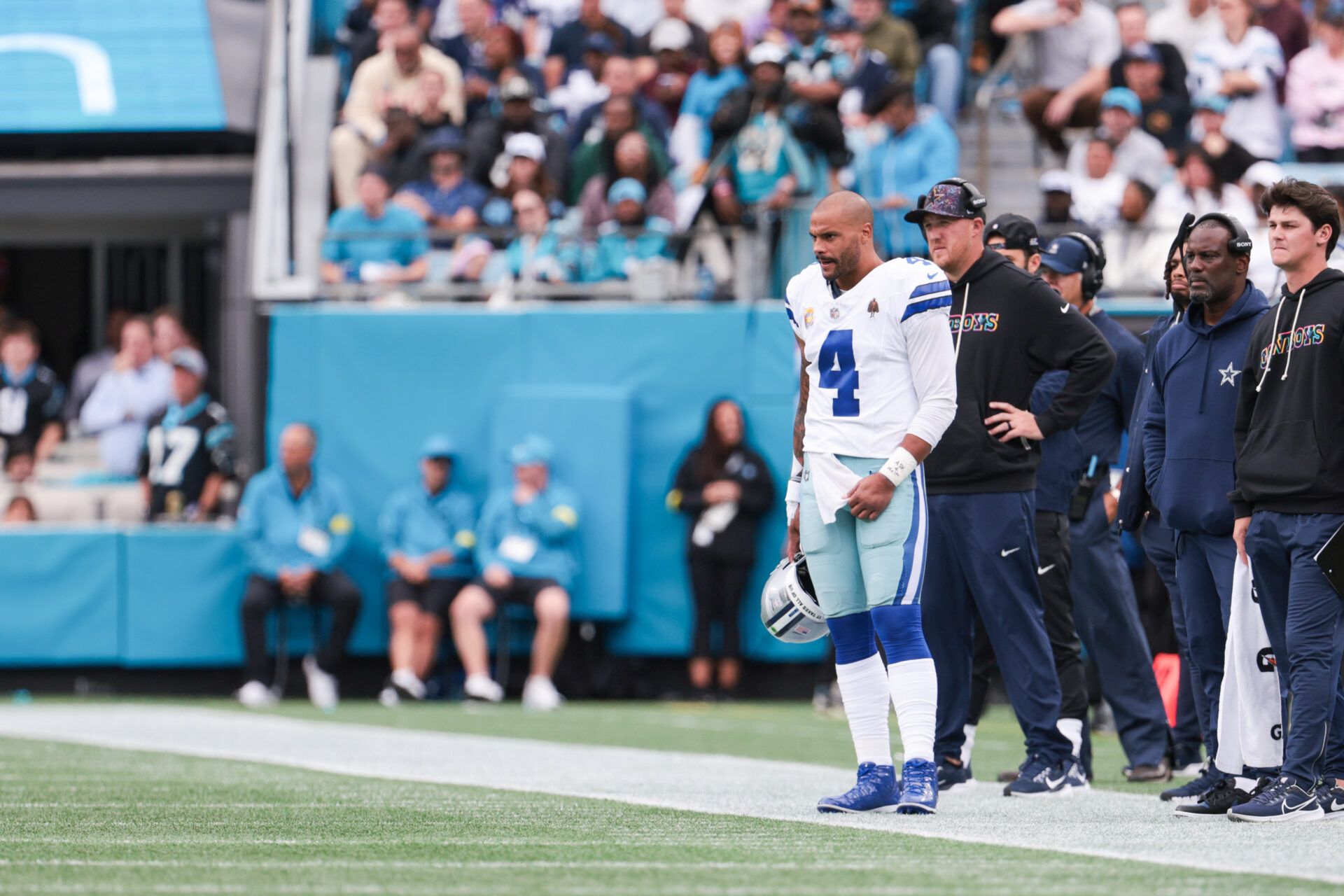 Dallas Cowboys quarterback Dak Prescott (4) looks on from the sideline during the game against the Carolina Panthers at Bank of America Stadium.