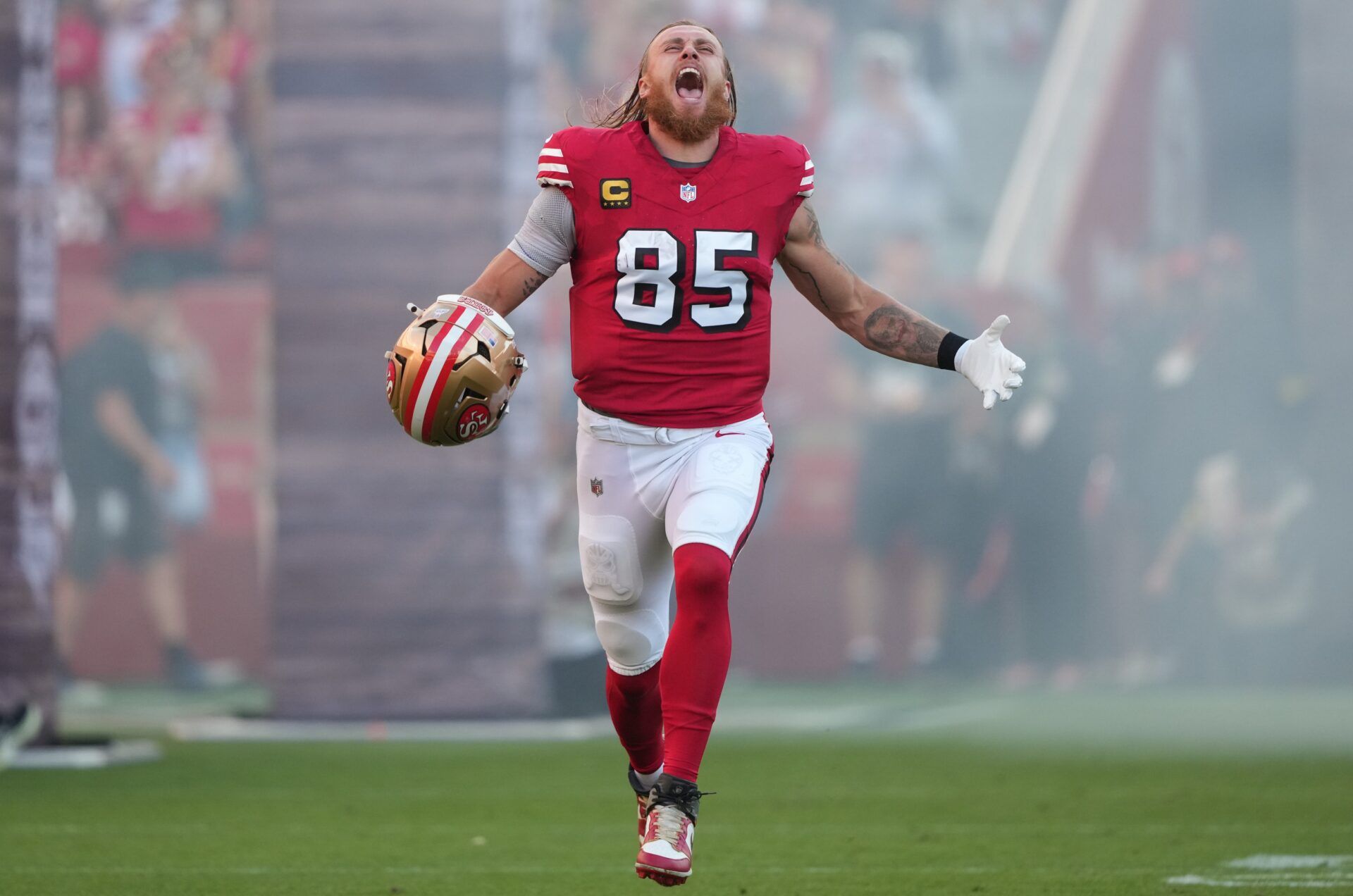 San Francisco 49ers tight end George Kittle (85) runs onto the field prior to the game against the Atlanta Falcons at Levi's Stadium.