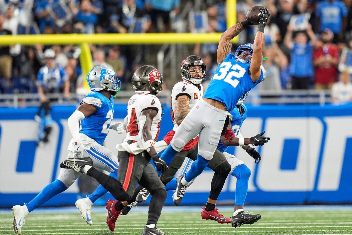 Detroit Lions safety Brian Branch (32) intercepts a pass intended for Tampa Bay Buccaneers wide receiver Chris Godwin (14) during the first half at Ford Field in Detroit on Sunday, September 15, 2024.