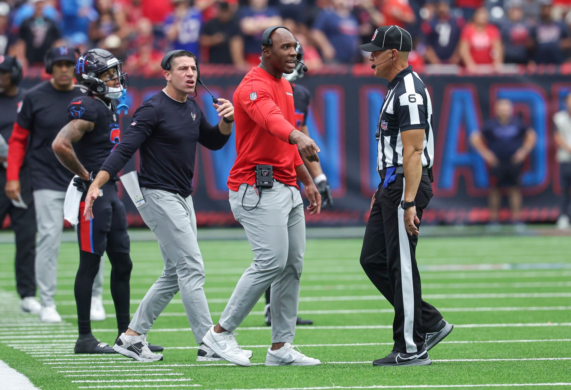 Houston Texans head coach DeMeco Ryans discusses a call with a referee during the fourth quarter against the Buffalo Bills at NRG Stadium.