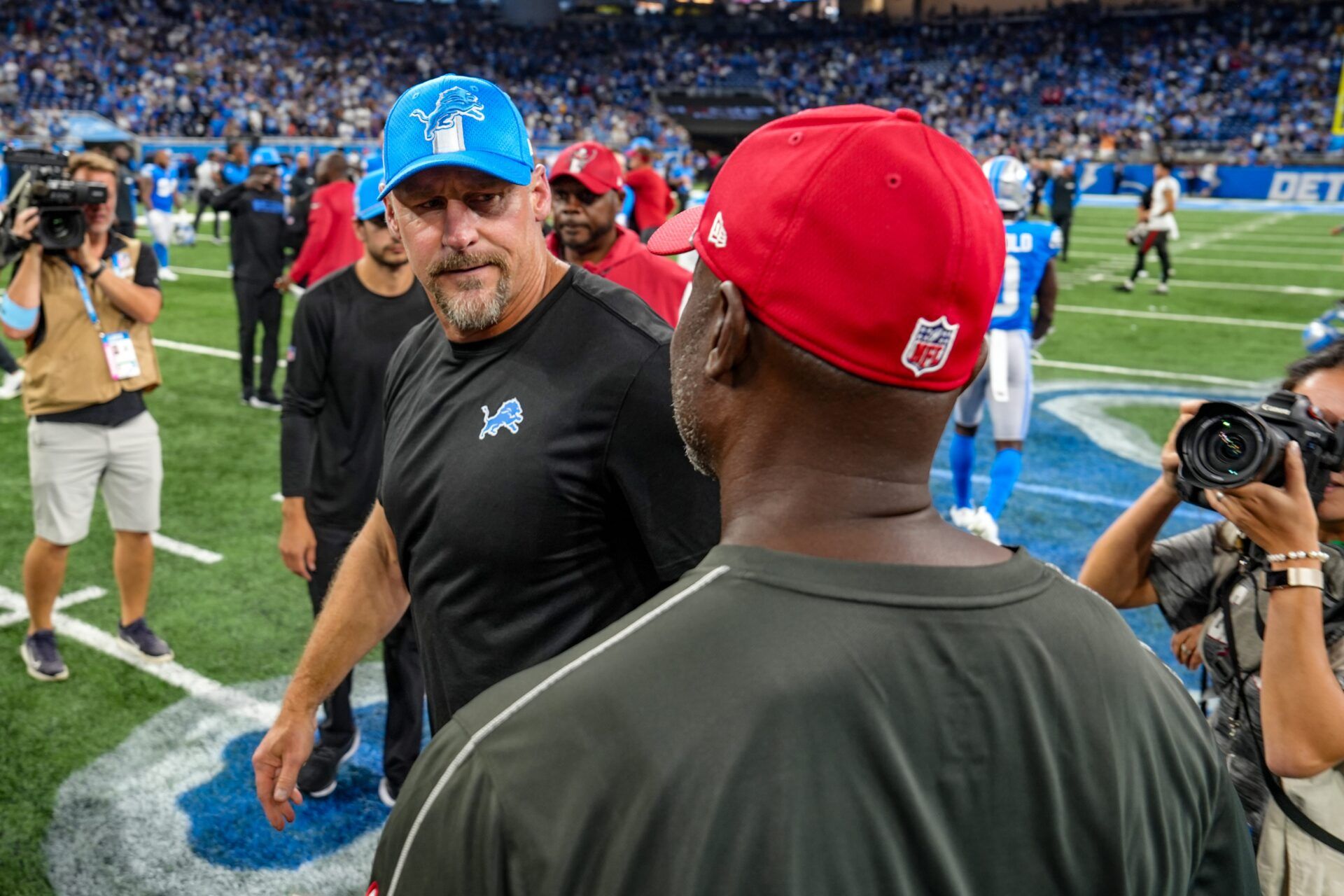 Detroit Lions head coach Dan Campbell shakes hands with Tampa Bay Buccaneers head coach Todd Bowles at the end of the Detroit Lions game against the Tampa Bay Buccaneers at Ford Field in Detroit on Sunday, Sept. 15, 2024. Buccaneers won 20-16.