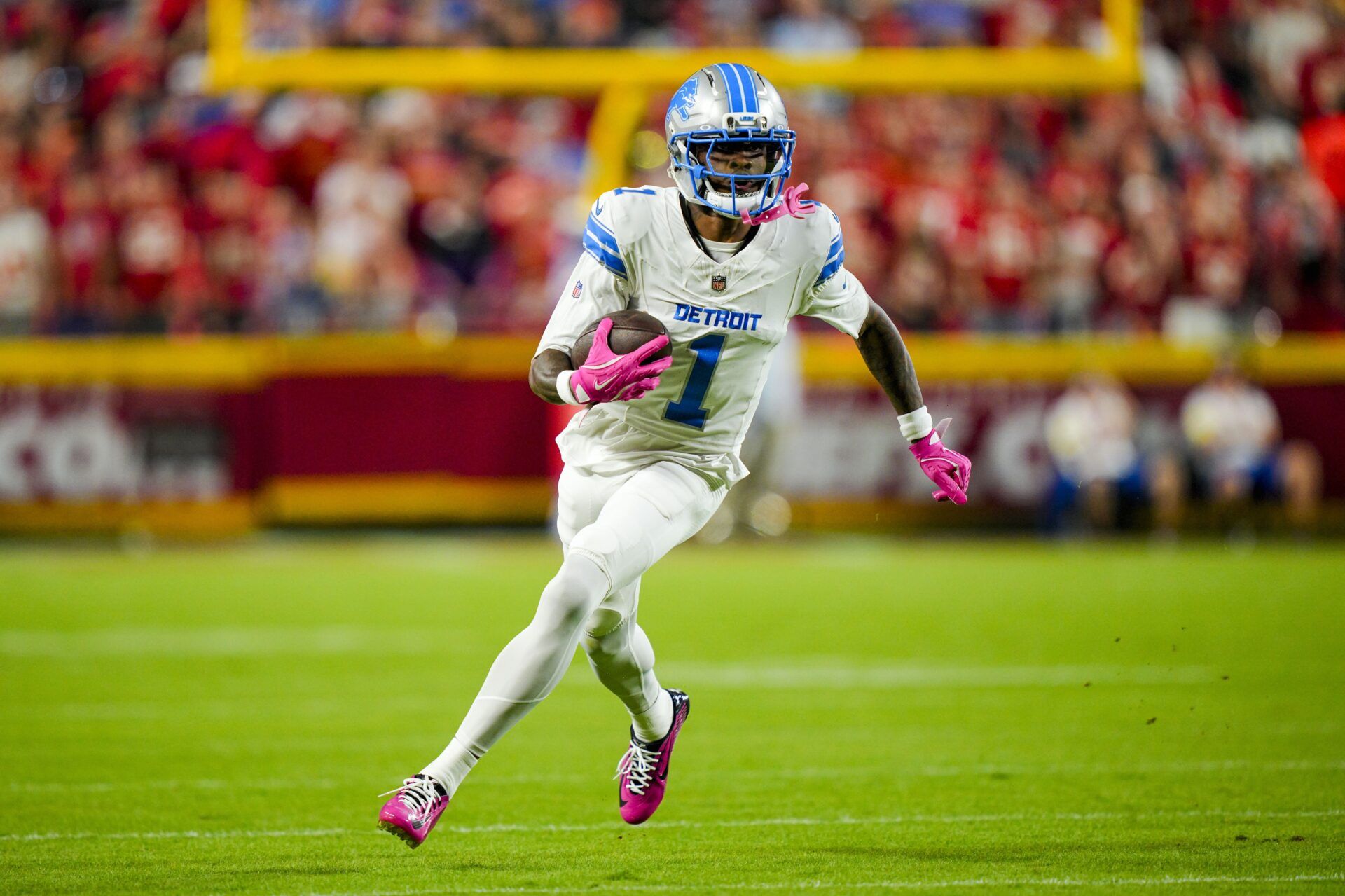 Detroit Lions wide receiver Jameson Williams (1) runs with the ball during the first half against the Kansas City Chiefs at GEHA Field at Arrowhead Stadium.