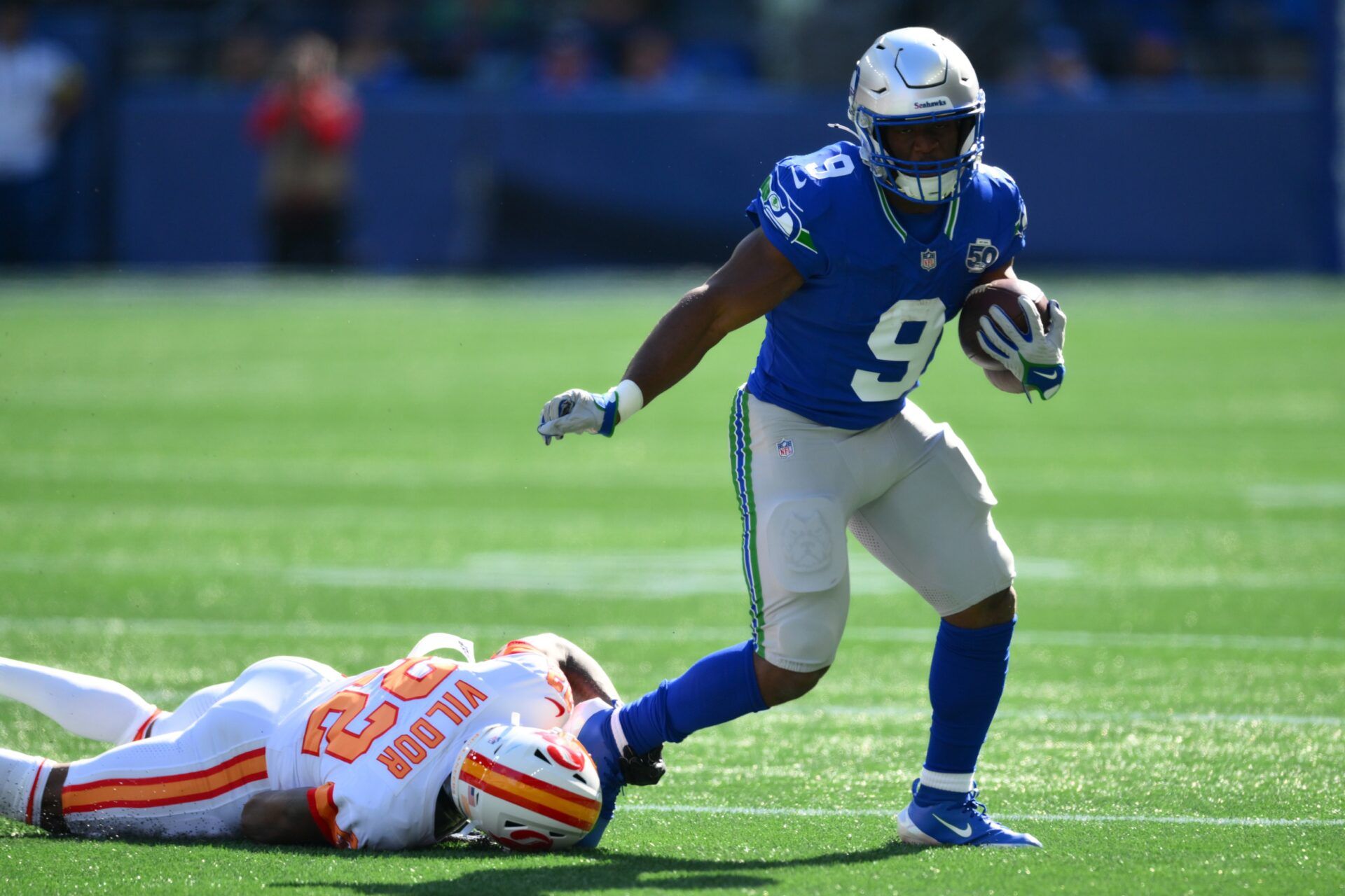 Seattle Seahawks running back Kenneth Walker III (9) carries the ball as. Tampa Bay Buccaneers cornerback Kindle Vildor (22) defends during the first half at Lumen Field.