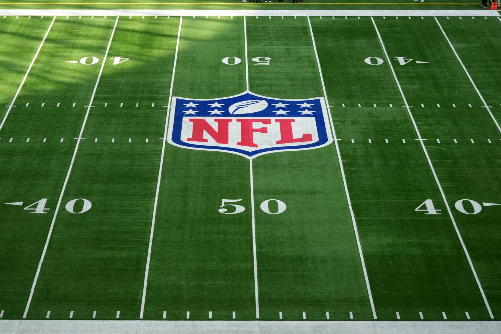 The NFL shield logo a midfield during an NFL International Series game at Tottenham Hotspur Stadium.