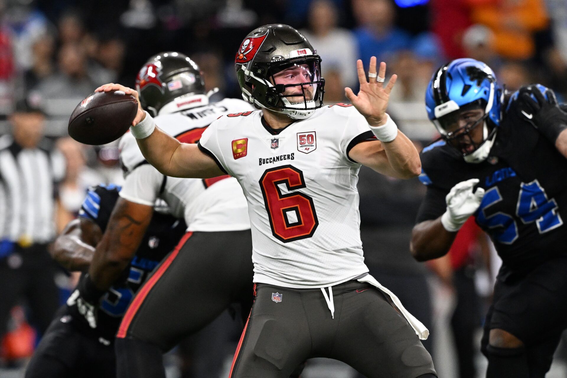 Tampa Bay Buccaneers quarterback Baker Mayfield (6) drops back to pass against the Detroit Lions during the first half at Ford Field.
