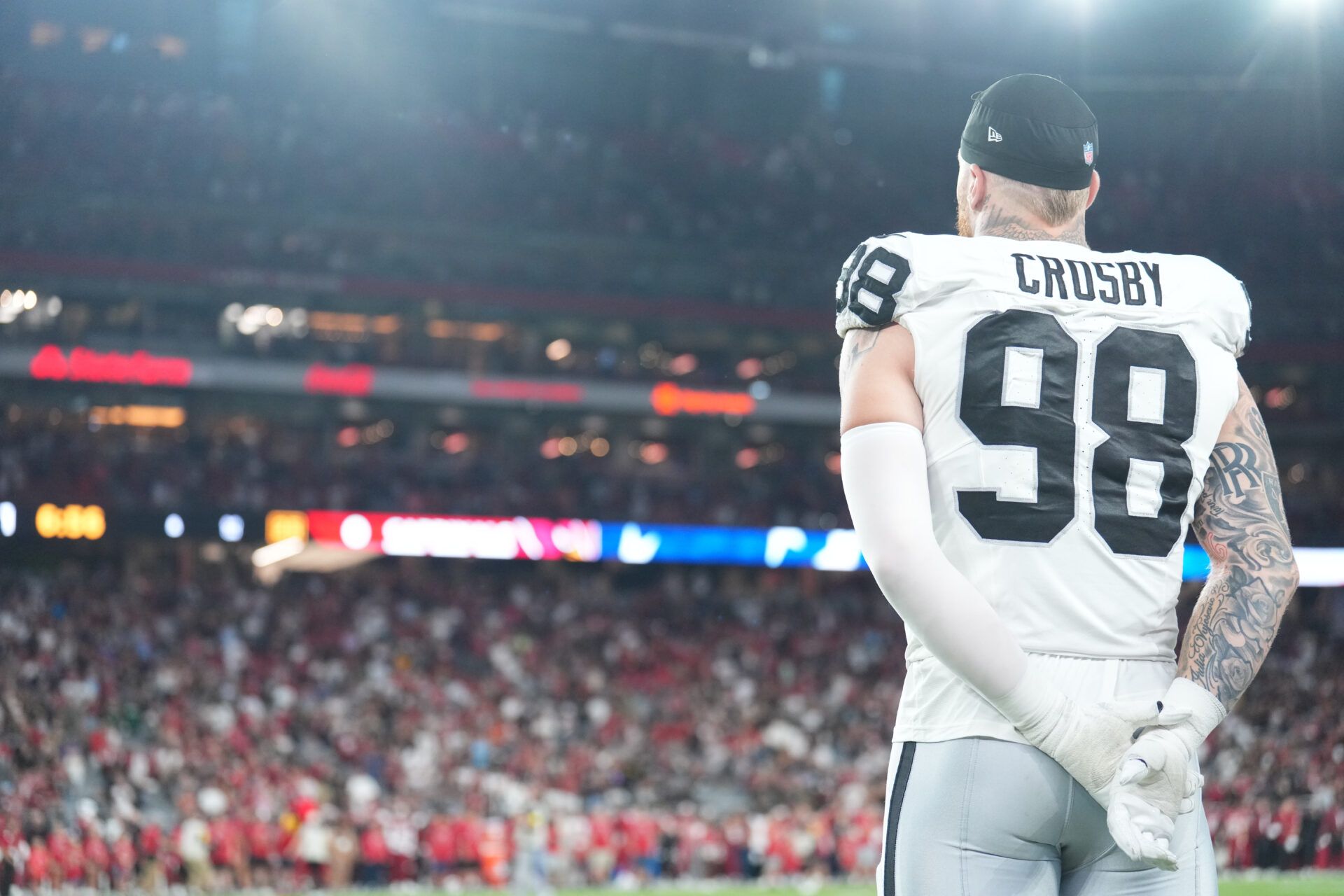 Las Vegas Raiders defensive end Maxx Crosby (98) looks on against the Arizona Cardinals during the first half at State Farm Stadium.