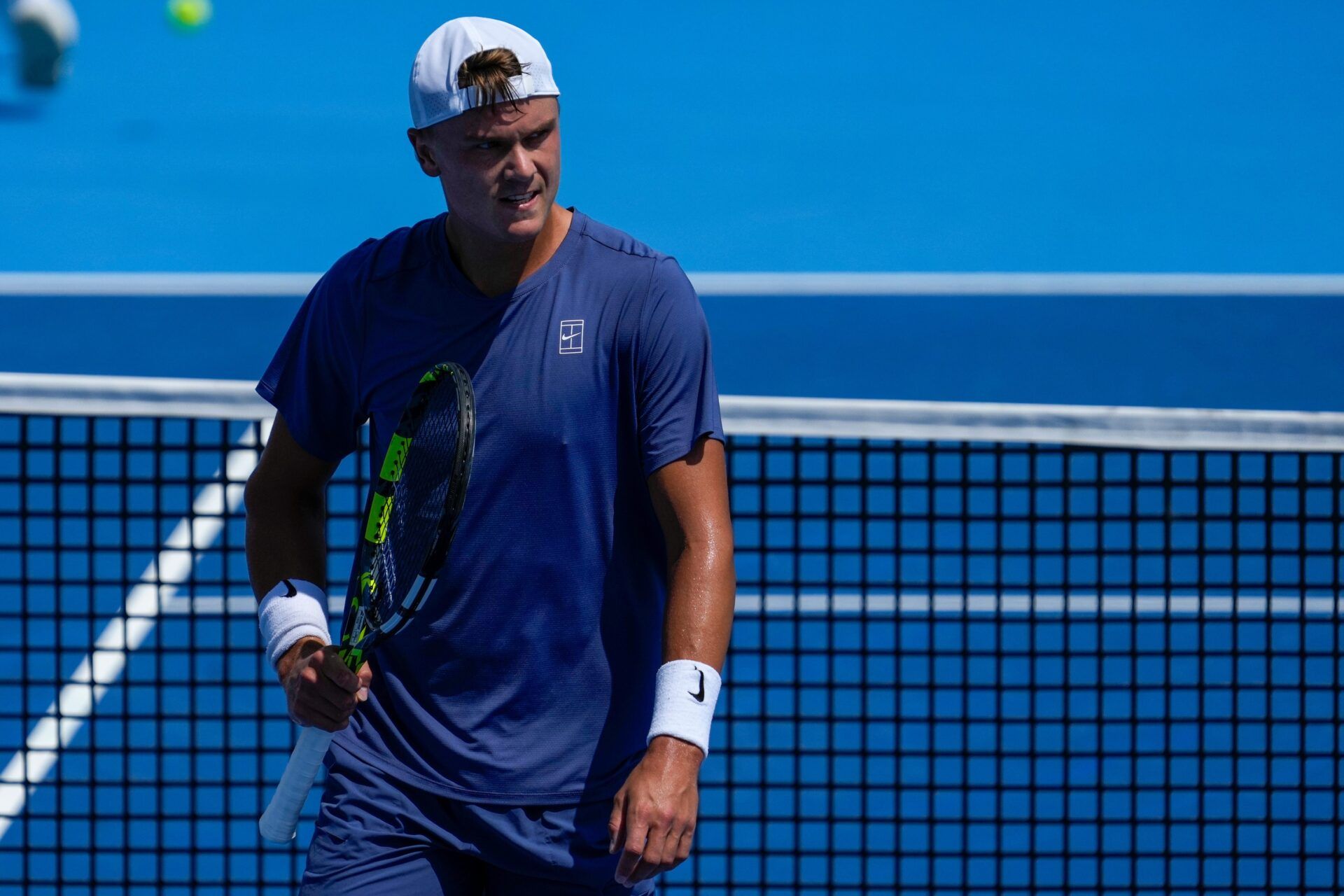 Holger Rune looks to his coach between serves in the Cincinnati Open fourth round match between Francis Tiafoe and Holger Rune at the Lindner Family Tennis Center in Mason, Ohio, on Wednesday, Aug. 13, 2025. Rune advanced after Tiafoe retired in the second set.