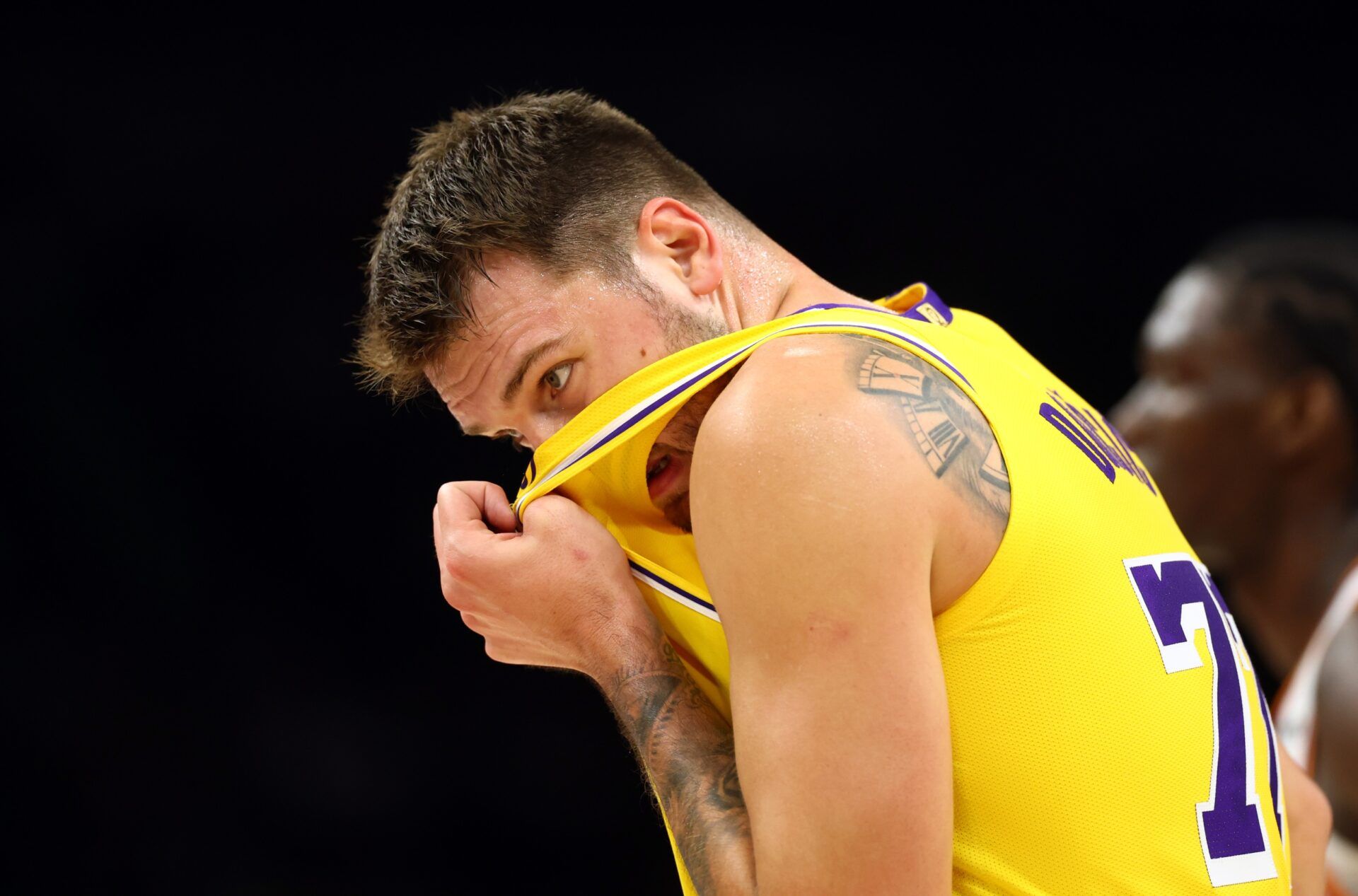 Los Angeles Lakers guard Luka Doncic (77) reacts against the Phoenix Suns during an NBA preseason game at Mortgage Matchup Center.